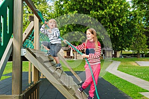 Portrait of a cute kids having fun on playground