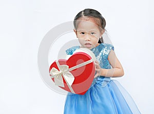 Portrait of a cute little Asian child girl with red heart gift box for Valentine festival isolated on white background