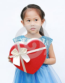 Portrait of a cute little Asian child girl with red heart gift box for Valentine festival isolated on white background