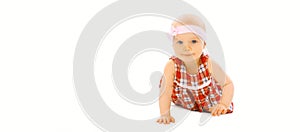 Portrait of cute little baby crawling and playing on floor on white background