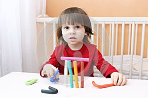 Portrait of cute little boy with playdough