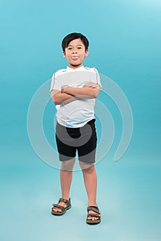 Portrait of cute little boy posing on white background