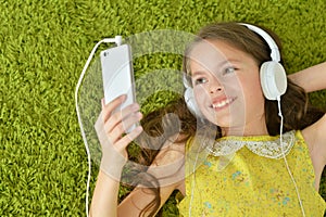 Portrait of cute little girl with headphones