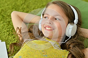 Portrait of cute little girl with headphones