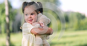 portrait cute little girl hugging teddy bear in park, happy family baby kid dream concept, kindergarten, children on the