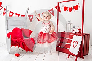 Portrait of a cute little girl in a red skirt