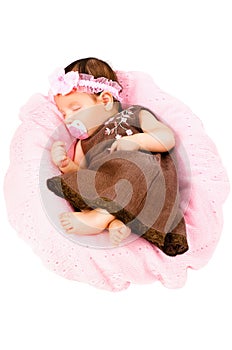 Portrait of a cute little girl sleeping in a dress