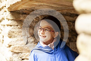 Portrait of a cute little girl wearing glasses and blue jacket