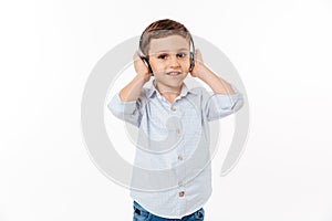 Portrait of a cute little kid in headphones