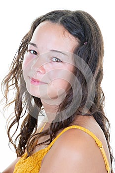 Portrait of cute lovely young woman with dark curly hair posing with kind smile isolated in white background