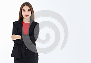 Portrait of cute mature businesswoman wearing black suit posing in professional confident with arms crossed, studio shot isolated