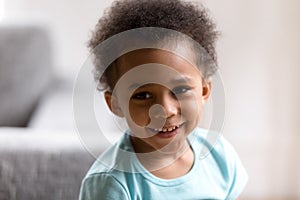 Portrait of cute mixed race toddler boy smiling