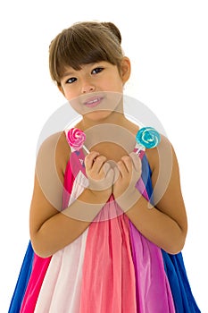 Portrait of cute preteen child having fun with lollipops