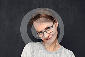 Portrait of cute and shy girl with eyeglasses