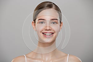 Portrait of a cute smiling girl in braces.