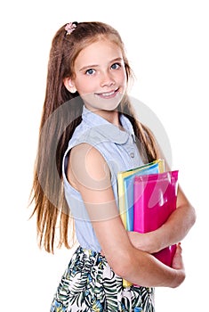 Portrait of cute smiling happy little school girl child teenager holding the books isolated