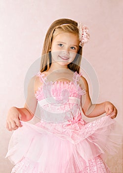 Portrait of cute smiling little girl in princess dress