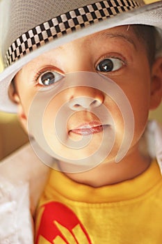 Portrait of a cute south asian boy wearing a fedora hat