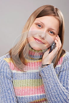 Portrait of a cute teen girl with phone