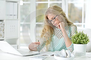 Cute teen girl doing homework