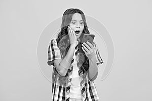 Portrait of cute teenage girl using mobile phone, chatting on web, typing sms message. Mobile app for smartphone