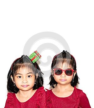 Portrait of cute twins beside each other on white background