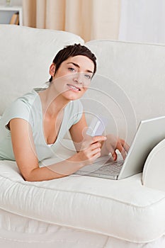 Portrait of a cute woman shopping online