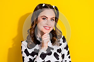 Portrait of cute woman touch chin wear glamour cow skin shirt pretty face model posing beauty makeup isolated on yellow