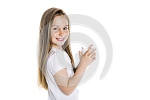 Portrait of a cute 7 years old girl Isolated over white background with milk glass