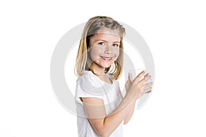 Portrait of a cute 7 years old girl Isolated over white background with milk glass