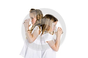 Portrait of a cute 7 years old girl Isolated over white background with milk glass