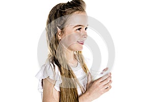 Portrait of a cute 7 years old girl Isolated over white background with milk glass