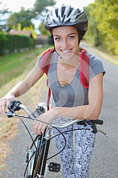 Portrait cyclist wearing helmet