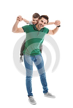 Portrait of dad playing with his son isolated