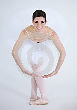 Portrait, dance and ballet with a woman in studio on a white background for rehearsal or recital for theatre performance