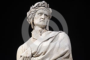 Portrait of Dante Alighieri statue in Santa Croce square in Florence at night