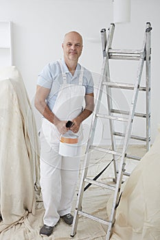 Portrait Of Decorator Painting Room