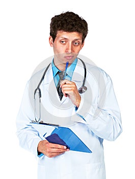 Portrait of deliberating young male doctor writing on a patient' photo