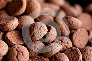 A portrait of a delicious dutch treat called pepernoten. Pepper nuts are a traditional cookie during holidays and saint nicholas