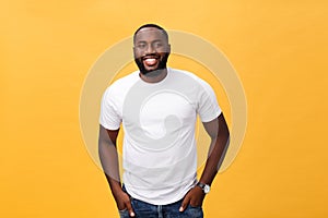 Portrait of delighted African American male with positive smile, white perfect teeth, looks happily at camera, being