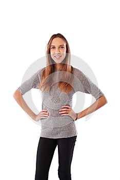 A portrait of delighted young girl looking at camera and keeping