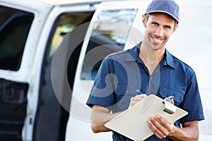 Portrait Of Delivery Driver With Clipboard