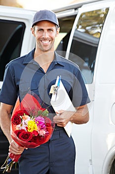 Portrait Of Delivery Driver With Flowers