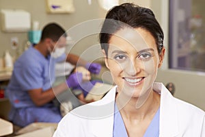 Portrait Of Dental Nurse In Dentists Surgery photo