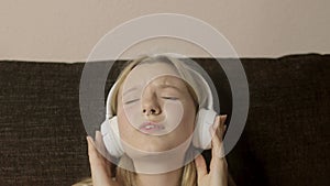 The portrait depicts a Gen Z girl with a nose piercing, lost in the rhythm of the music playing through her headphones