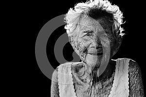 Portrait of depress and helpless elderly woman, grandma sitting