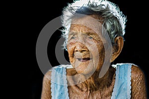 Portrait of depress and helpless elderly woman, grandma sitting