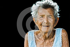 Portrait of depress and helpless elderly woman, grandma sitting