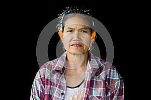 Portrait of depress and hopeless elderly woman isolated on blac