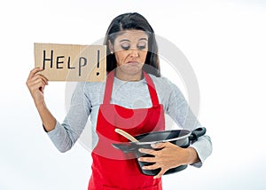 Portrait of desperate helpless inexperienced home cook woman asking for help wearing red apron learning to cook in cooking classes